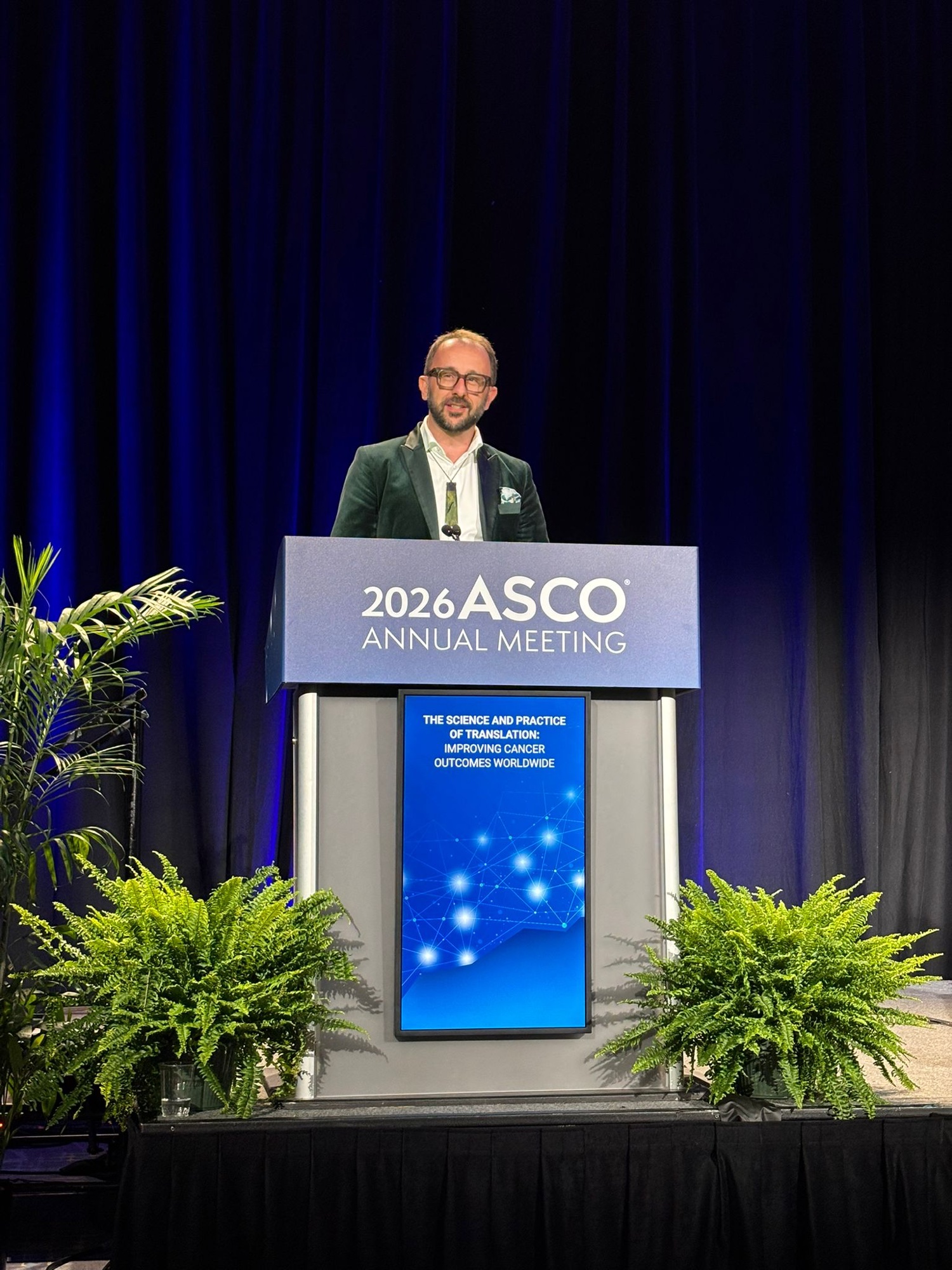 Chris Jackson speaking at the 2026 American Society of Clinical Oncology Annual Meeting